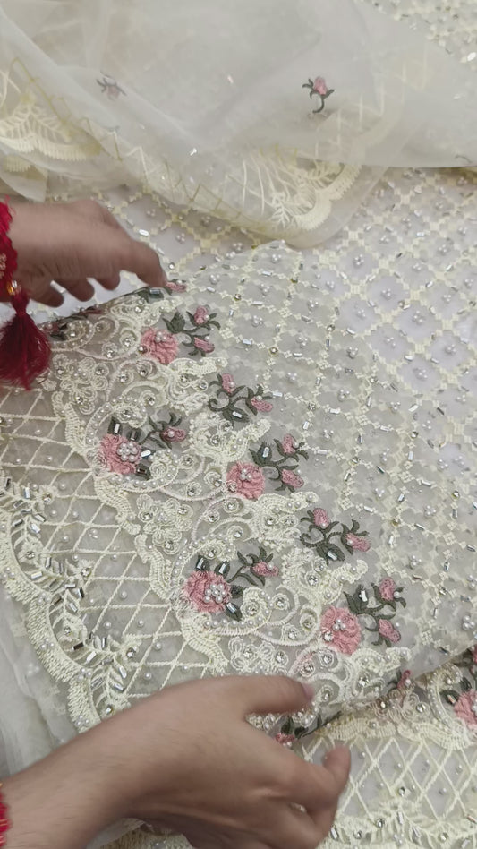 Fancy white organza embellished with pearls